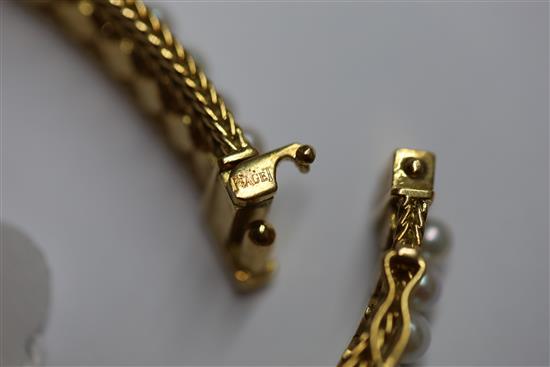 A ladys 20th century Piaget 18ct gold and graduated cultured pearl set manual back wind cocktail watch,